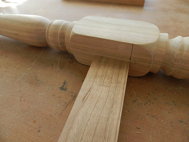 Lower rail of stool cut to length with a 6 degree angle at each end to align with the pencil mark on the leg