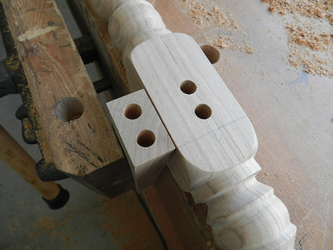 Drilled bores of dowel joint used to build the counter stool frame lower rail to leg assembly