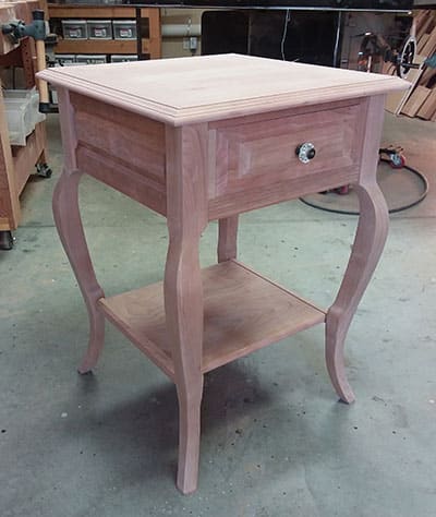 Bedside table built by Dowelmax inventor Jim Lindsay for this project article shown dry fitted in work shop before staining and finishing.