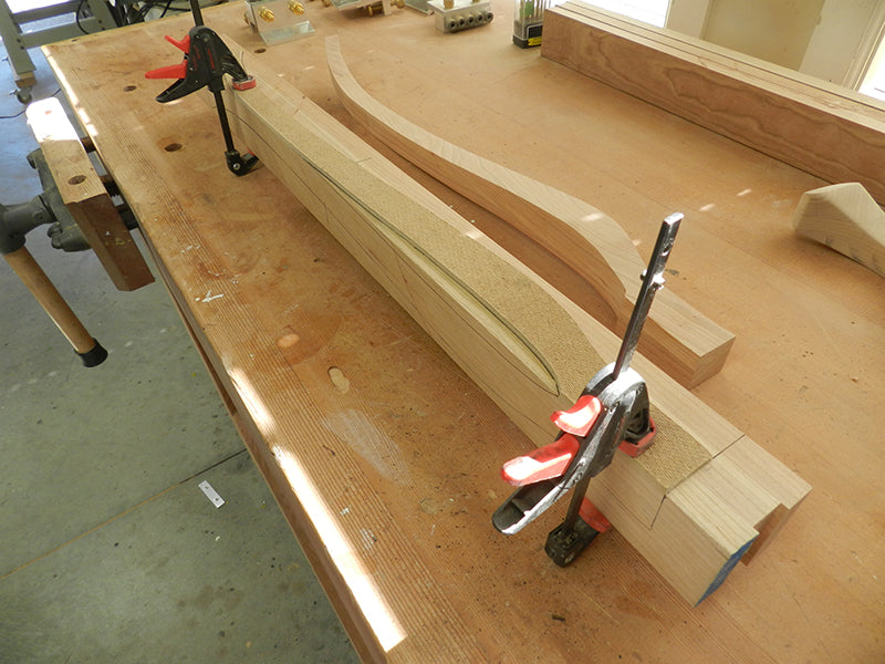 Cabriole leg template clamped to leg work piece to mark the shape outline