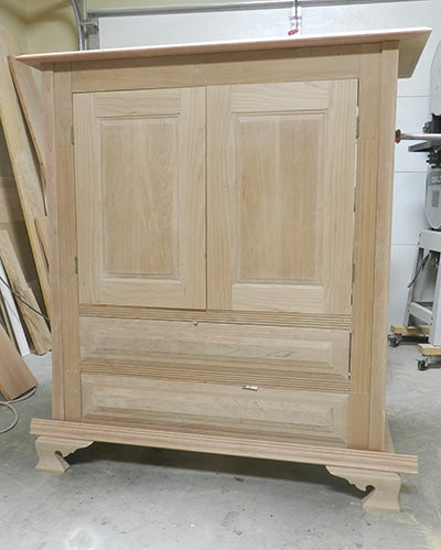 Armoire built by Dowelmax inventor Jim Lindsay shown dry fitted in work shop before staining and finishing.