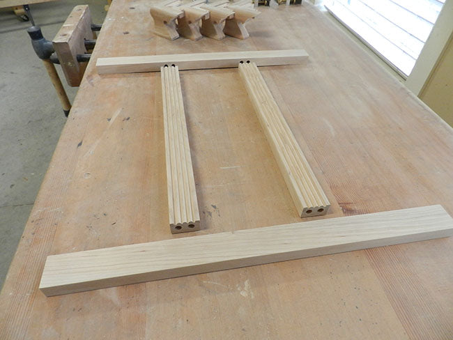 TV-stand-drawer-section-framework-work-pieces-laid-out-on-workbench