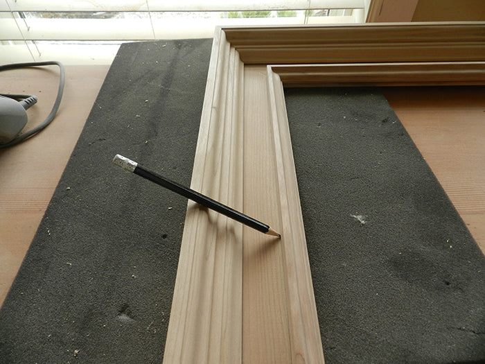 Annular space between mirror wall and rail marked with pencil line