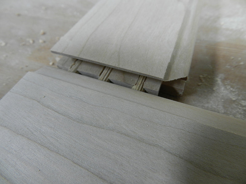 Bathroom cabinet raised panel door joint reinforced with 1/4 inch dowels.