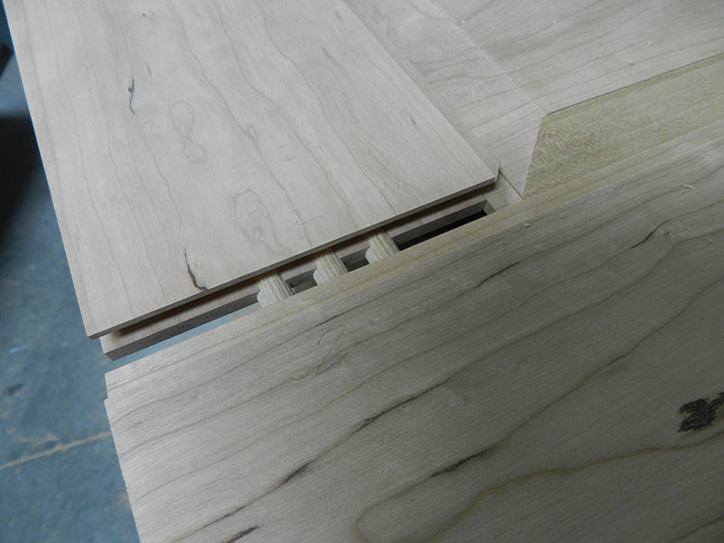 Bathroom cabinet raised panel side wall joint reinforced with 3/8 dowels.
