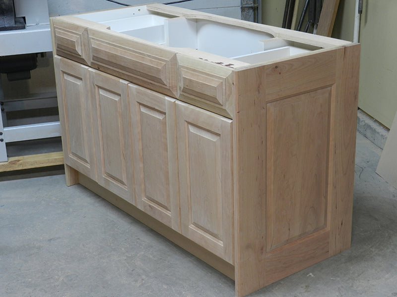 Bathroom vanity cabinet with re-faced doors, drawer fascias and side walls.