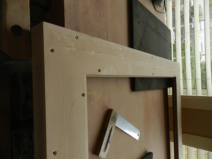 Countersunk holes to fasten large mirror moulding to rear plate