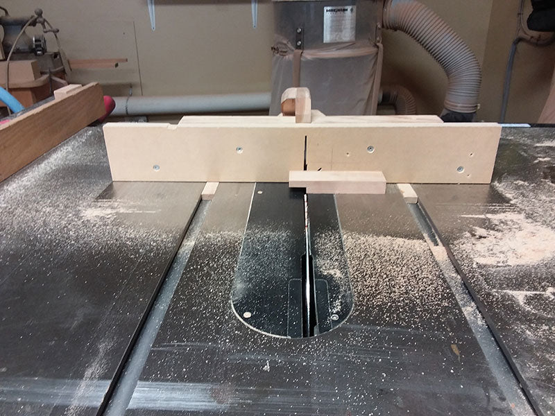 Cutting the half lap joints used to build the bedroom table drawer fascia with the table saw sled
