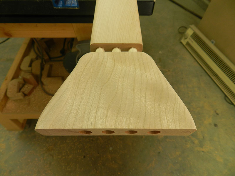 Dowel joint between decorative plate and tie rail used to build the entryway table frame assembly lower longitudinal section