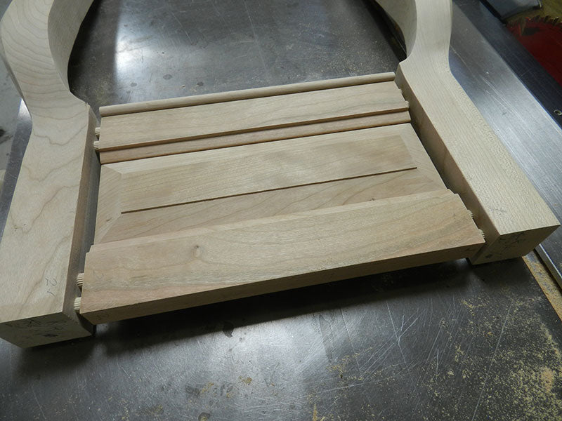 Dowel joints between the cabriole legs and end panel rails used to build the entryway table frame assembly corner section