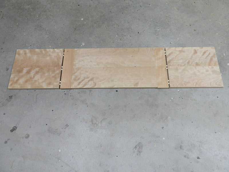Dowel joints between transverse rails and left and right panels used to build the entryway table top assembly main section