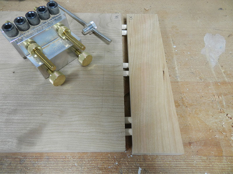 Dowel joint between transverse rail and center panel used to build the entryway table top assembly main section