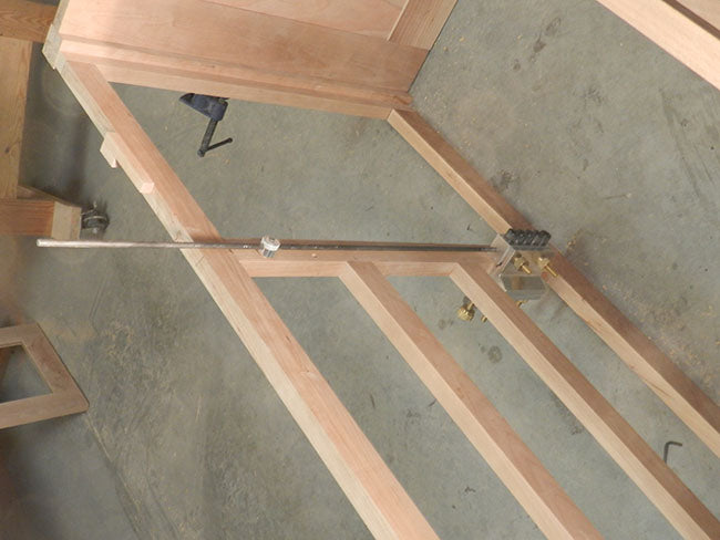 dowelmax-and-distance-gauge-used-to-reference-TV-stand-bulkhead-dowel-bores