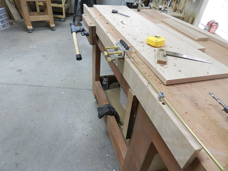 Dowelmax extended distance gauge used to align bores along mitered edge rail