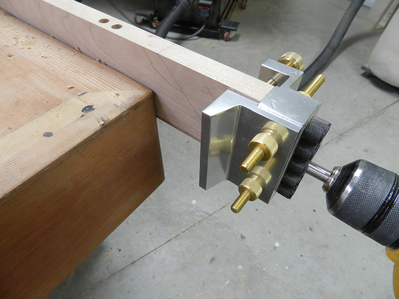Dowelmax used to drill into mitered rail end before cutting miter