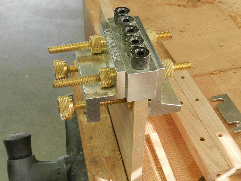 Dowelmax dowel jig with 1/8 spacer used to center on plant stand project 1/2 inch thick lower shelf work piece