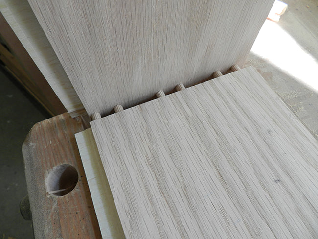 The bottom plate creates another problem with respect to visible laminations or end grain, consequently I cut a half inch recess at each lower inner edge, into which the lower plate fits.  I have also used this plate to ensure the assembly is square durin