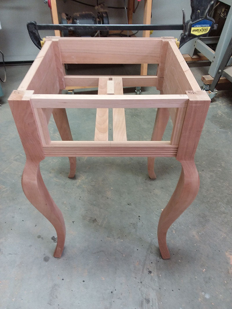 The two drawer guides and one drawer slide (shown inverted) used to build the bedside table frame drawer section