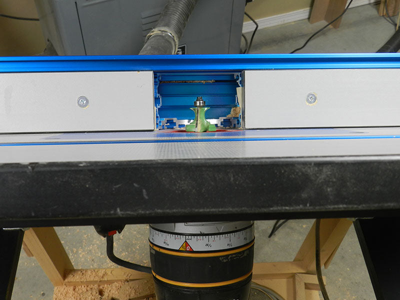 The improved view from a standing position of the router bit in a table mounted router with the Dowelmax lift in the open position