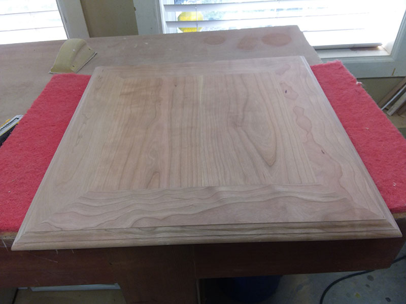 Joined mitered rails and center panel used to build the bedside table top assembly