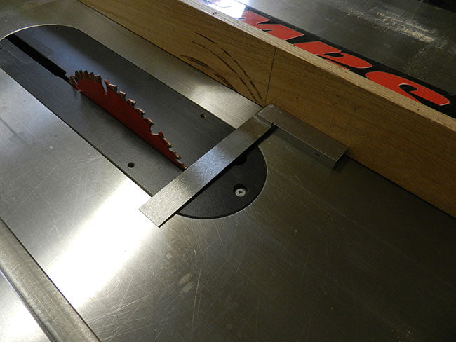 Leading edge of tablesaw blade marked on fence