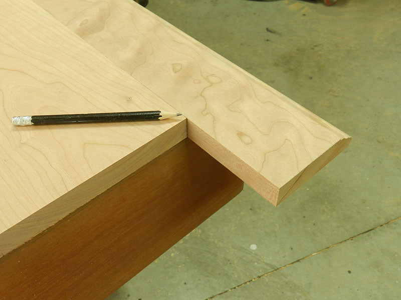 Line scribed at intersection of top plate and mitered edge rail