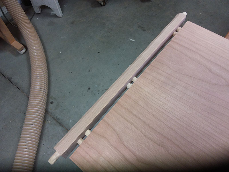 The lower rail to shelf dowel joint used to build the bedside table frame assembly lower section