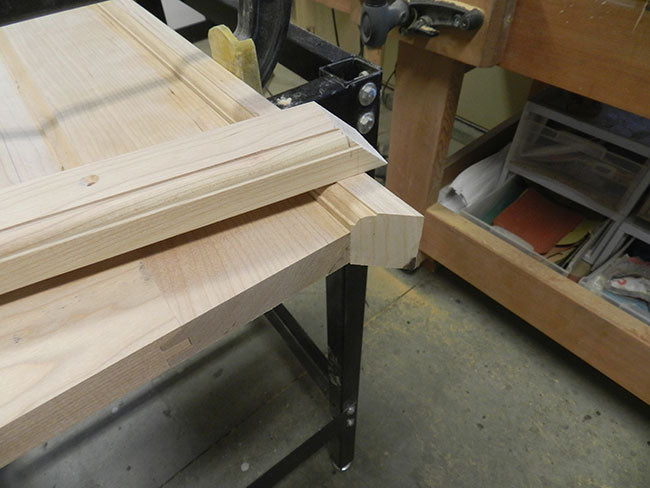 Mitered boundary rails for footboard