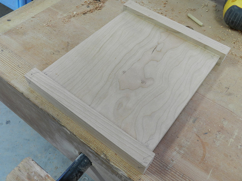 Plant stand project lower rails clamped to shelf to locate alignment marks for Dowelmax dowel jig