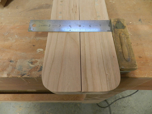 Reference line for junction of leg and raised panel for footboard