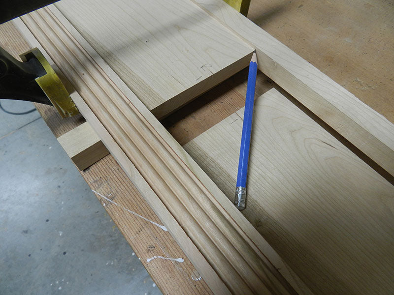 Marking 1 of 4 reference lines for the left and right panels used to build the entryway table front fascia assembly
