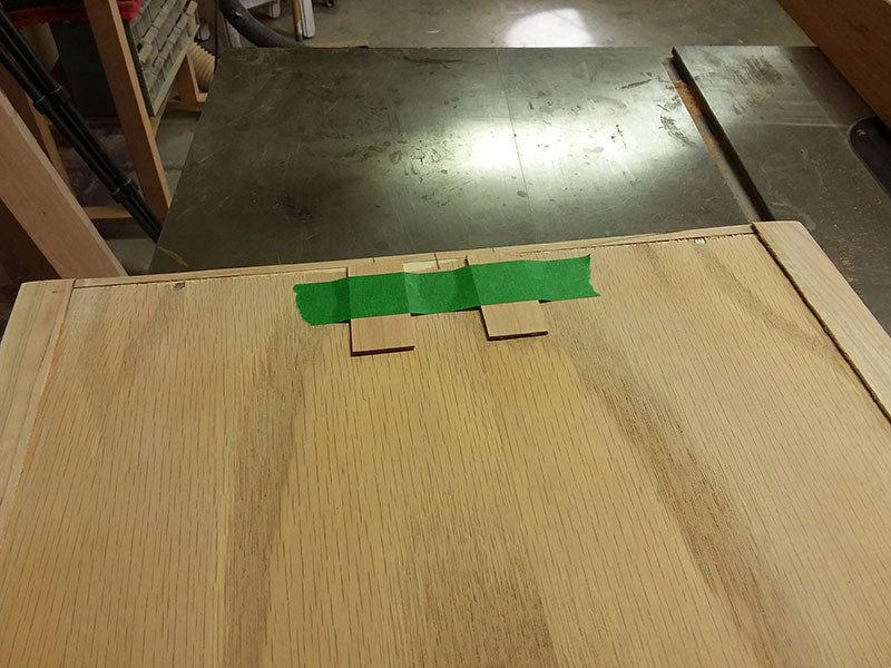 Risers used at rear of bedside table drawer bottom to prevent angular misalignment with respect to the drawer fascia panel