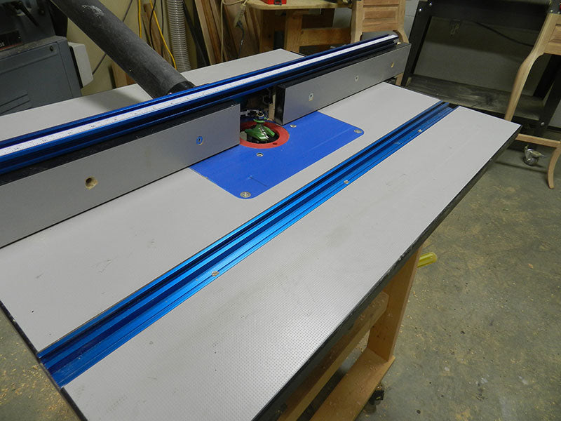 Router bit installed in table mounted router to mill profile on the rails used to build the entryway table frame assembly perimeter section