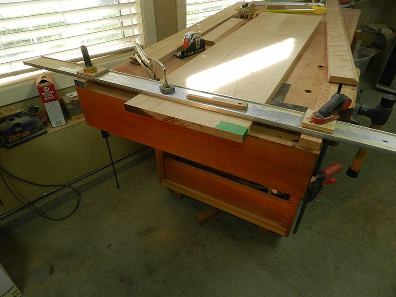 Router fence clamped perpendicular to long edge of book case top plate