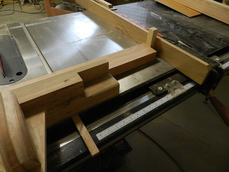 Shop made table saw sled with stop arrangement for accurately cutting the legs used to build the counter stool frame assembly