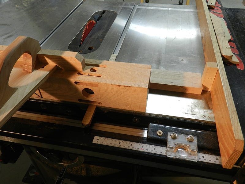 1 inch spacer used as stop between work piece and table saw fence to ensure all work piece lengths are identical.