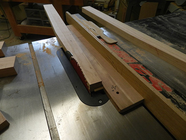 Tapered leg of bed headboard cut in tablesaw