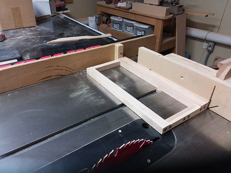 The drawer fascia used to build the bedroom table frame front section trimmed to length in the table saw