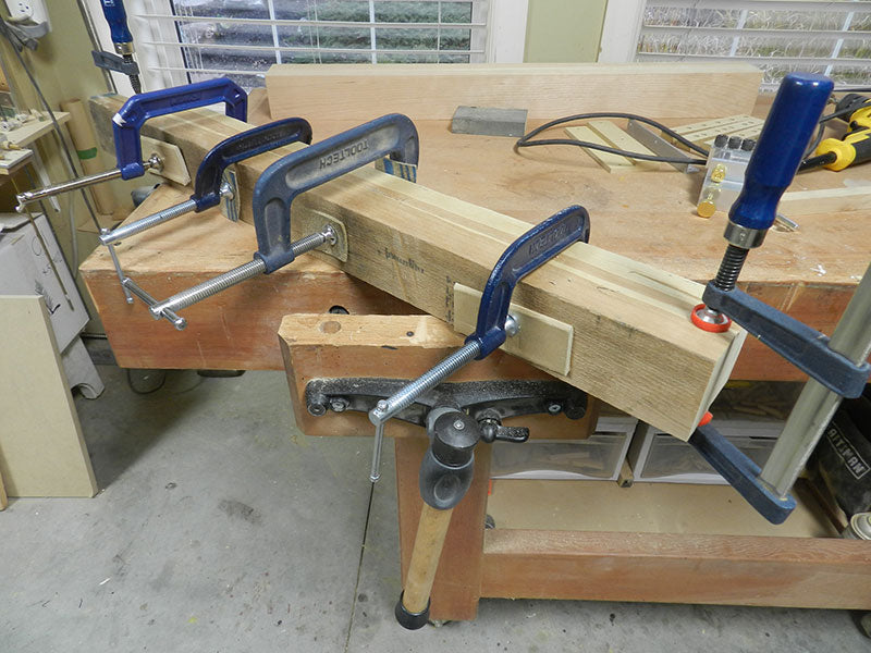 The two 2 inch timbers laminated to build the entryway table cabriole leg work piece block for cutting in the band saw