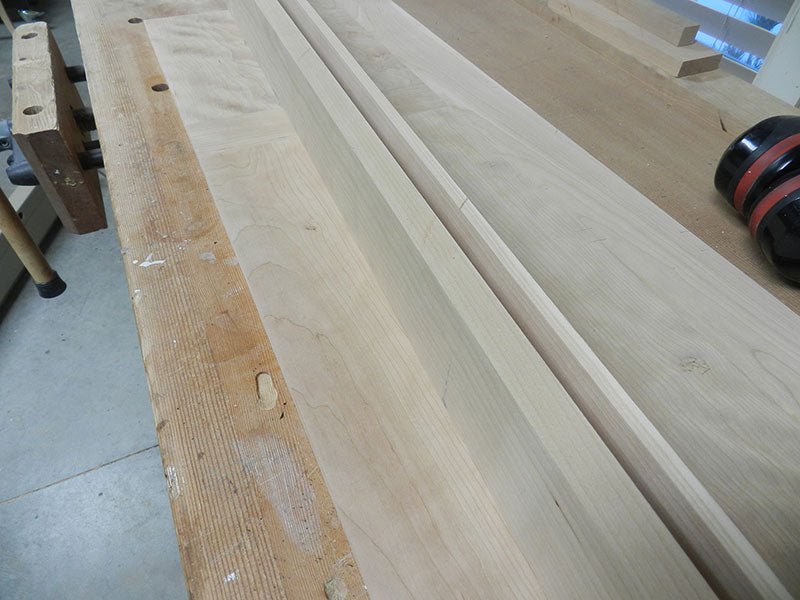 Two work pieces to be laminated together to build one of the entryway table perimeter rail assemblies
