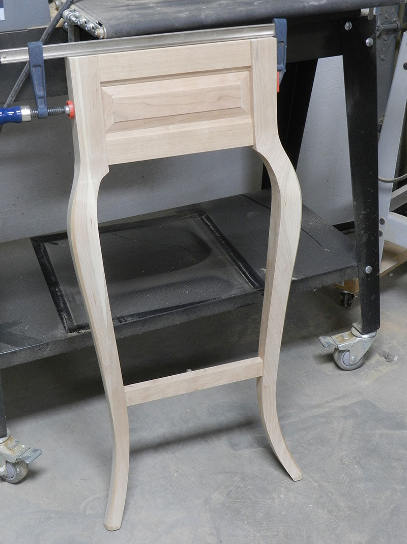 Upper panel assembly, lower rail and cabriole legs fitted together and clamped to build the entryway table frame assembly end section