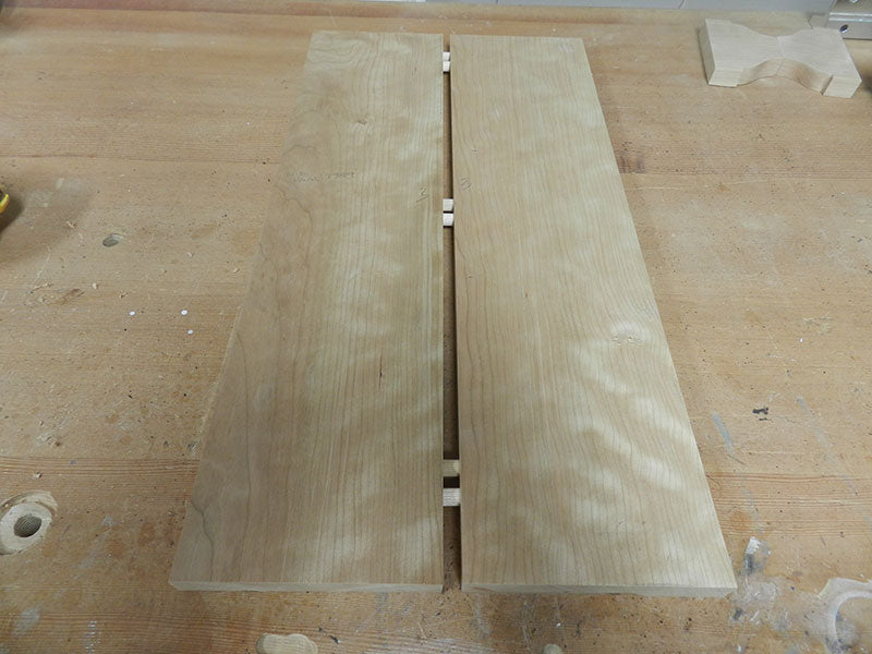 Work pieces edge joined with dowels to build the entryway table top main section middle panel assembly