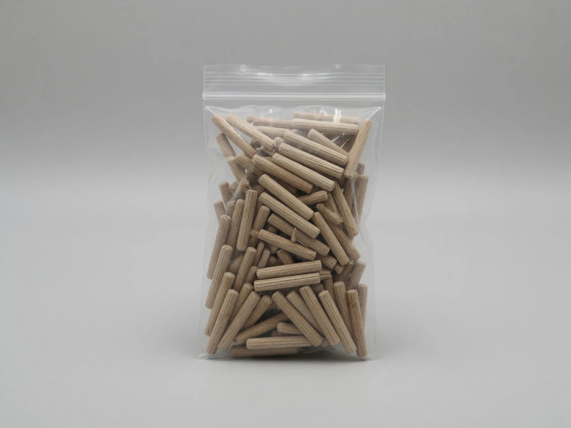 Retail bag of Dowelmax one-quarter by one-and-one-half-inch fluted hardwood dowel pins