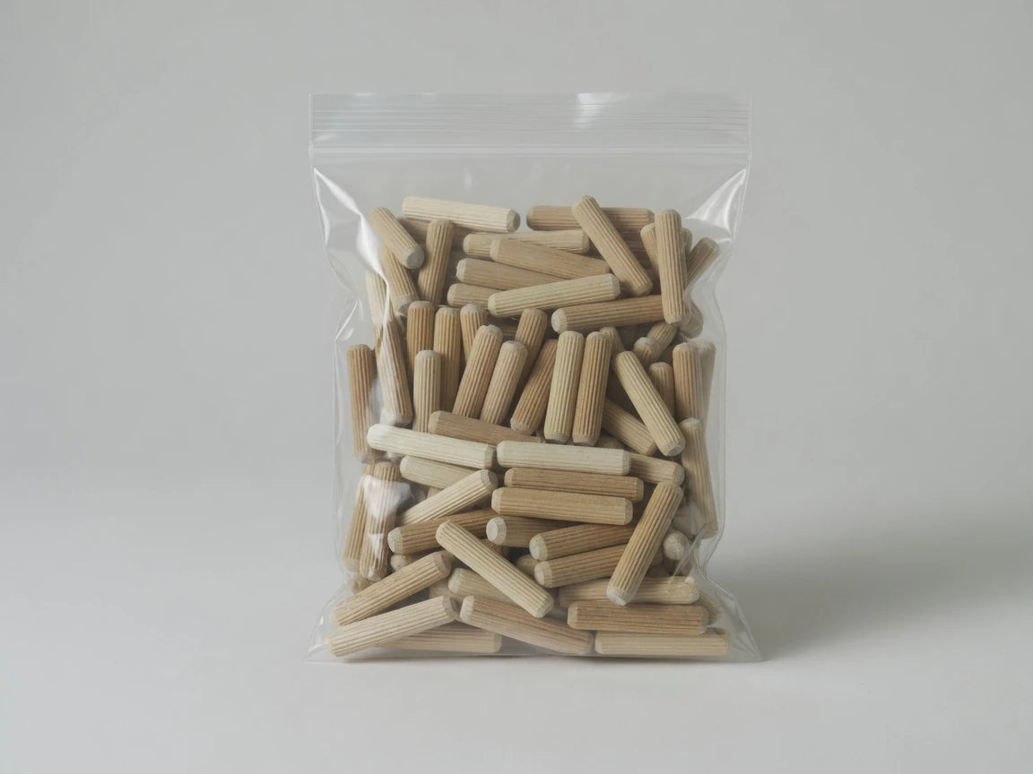 Retail bag of Dowelmax five-sixteenths by one-and-one-half-inch fluted hardwood dowel pins