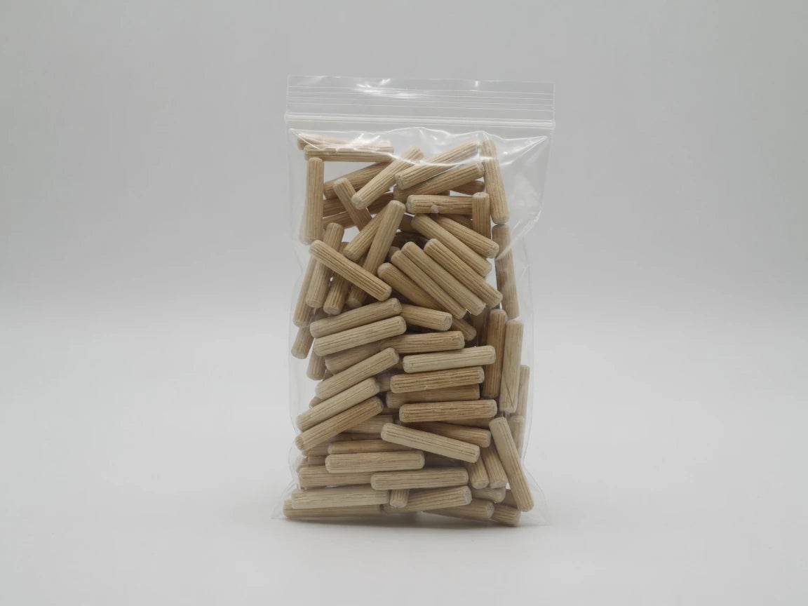 Retail bag of Dowelmax three-eighths by one-and-one-half-inch fluted hardwood dowel pins